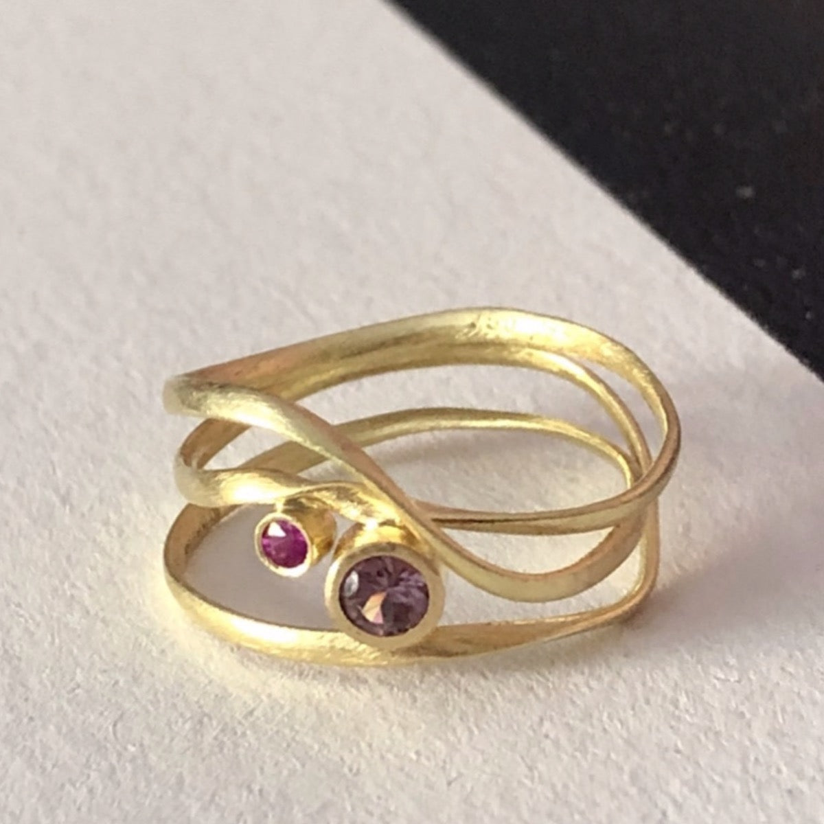 Flair ring 3 windings in 18 kt. recycled gold, with Ruby and Sapphire